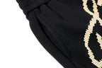 Yiaknis Wide-Leg Trousers, Script Letter, Black and Orange – photo 16